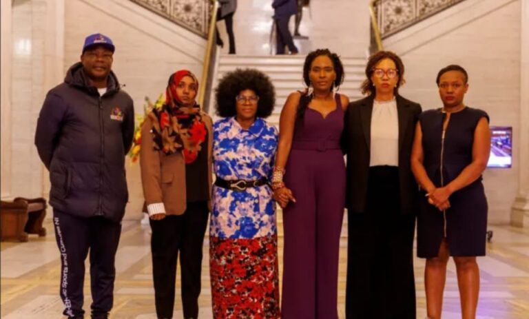 Sudanese community representatives at the Stormont leaders' press conference